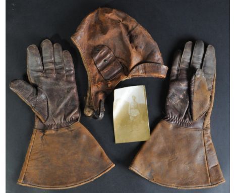 An original WWI First World War era RFC Royal Flying Corps pilot's leather flying helmet and accompanying gloves. The helmet 