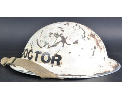 An original WWII Second World War British Civil Defence steel Brodie helmet. Original white paint scheme, with ' Doctor ' to 