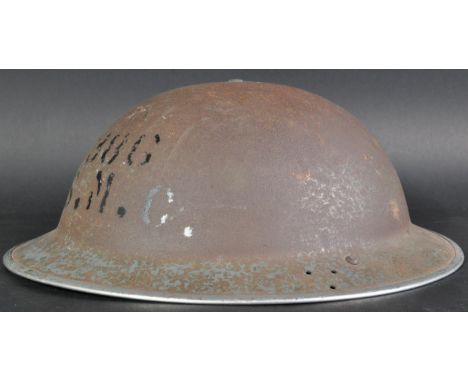 An original WWII Second World War ARP / Civil Defence 1940 dated steel brodie combat helmet. Painted with ' 386 SMC ' to fron