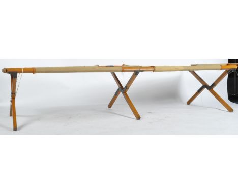 A WWII Second World 1941 dated British Army issued folding camping bed / mess bed. Canvas construction, with wooden supports.