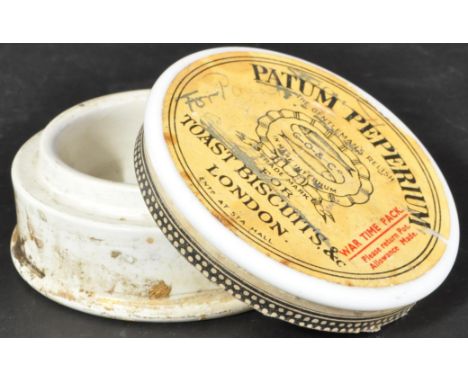 A WWI First World War period ' Patum Peperium ' (Gentlemen's Relish - Fish Paste) ceramic jar with lid. Retains original pape
