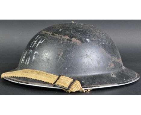 An original WWII Second World War British Civil Defence ARP Air Raid Precautions steel Brodie helmet. Brim dated 1939, with o