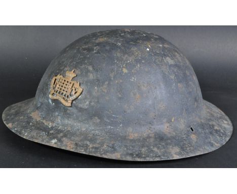 An original WWI First World War British Army steel Brodie ' Tommy ' helmet. Seamless brim, with impressed marks ' HS 139 ' to