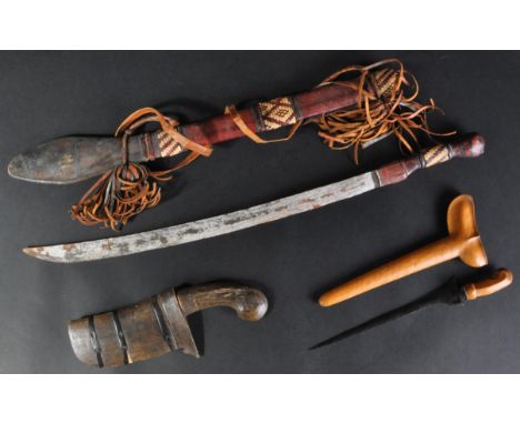 A collection of x3 assorted early 20th Century tribal Middle Eastern daggers, comprising a larger leather scabbard bound exam