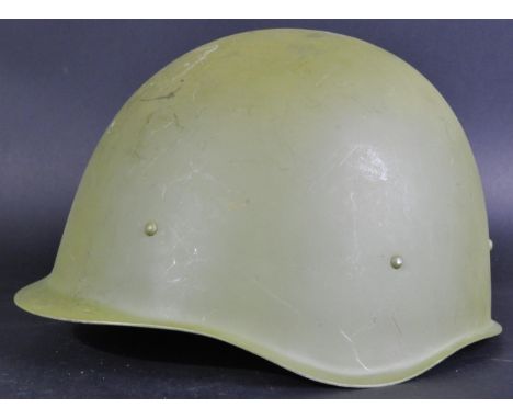 A Post-WWII Second World War 20th Century believed Russian infantry steel uniform helmet. Complete with liner and chin strap.