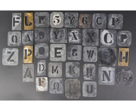 A collection of assorted vintage WWII Second World War interest British Military brass letter and numerical stencils - likely