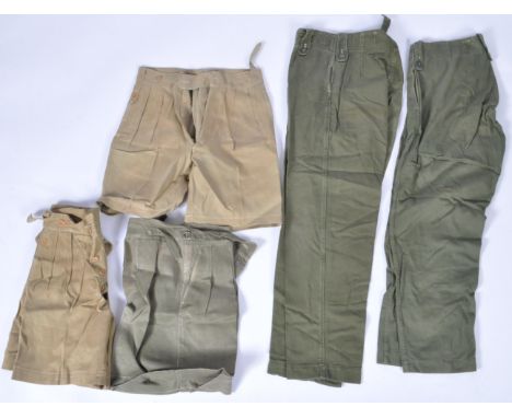 A collection of x5 vintage post-WWII Second World War British Army issued uniform trousers. Varying shades of green, some lik