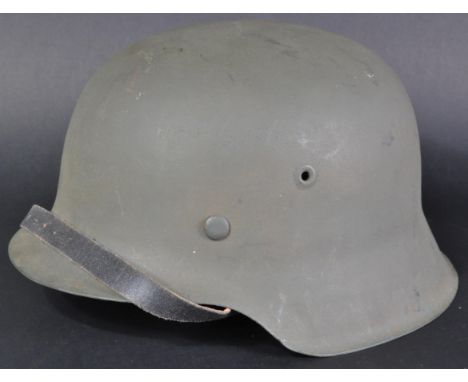 A WWII Second World War period Third Reich Nazi German Stahlhelm steel combat helmet, M42 pattern. Complete example, with ori