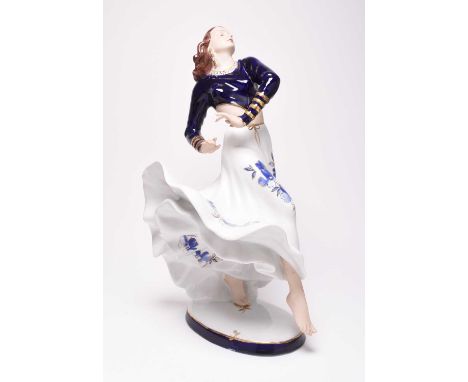 A large contemporary Royal Dux model of Rita Hayworth, post-1993, modelled dancing in a voluminous skirt with blue and gilt f