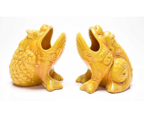 A pair of Burmantofts faience grotesque spoon warmers in the form of toads, circa 1885-90, pale ochre or yellow glaze, impres