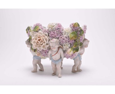 A group of Continental porcelain, late 19th and 20th centuries, comprising a group of Dresden style floral-encrusted wares, i