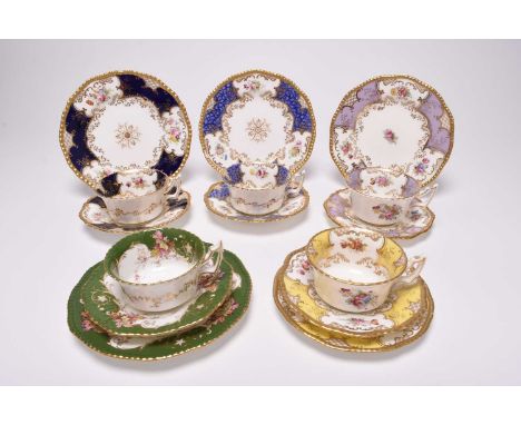 Five Coalport trios of teacup, saucer and side plate, late 19th/early 20th century, comprising four batwing examples, in lila
