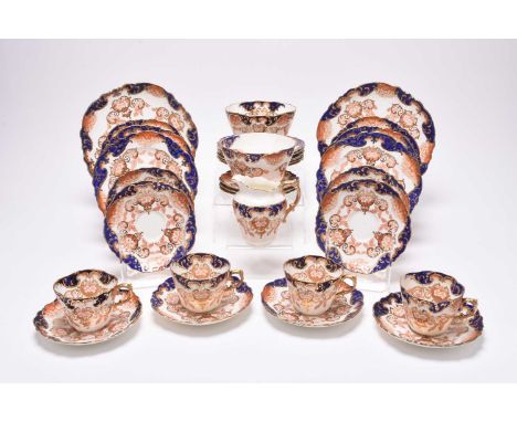 An Edwardian Aynsley part tea service, circa 1900-1910, transfer-printed in underglaze red and blue with flowers and foliage,