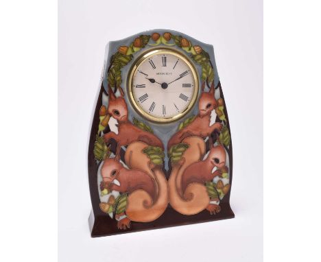 A Moorcroft limited edition 'Red Squirrels' mantel clock, dated 2012, numbered 1/75, painted and impressed marks, 21cm high; 