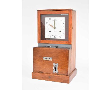 A National Time Recorder Co, factory clockFirst half 20th century, stained beech case, the 8.25 inch enamel dial with Arabic 