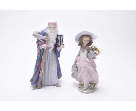 A Lladro Millenium porcelain figure of 'Old Father Time', model 6696, with stand, sold together with a Lladro porcelain figur