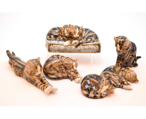 A group of six Clare McFarlane (Living Ceramics) models of tabby cats, 20th/21st century, including two seated upon a cushion