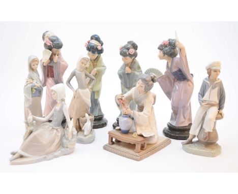 A collection of Lladro porcelain, including a girl with a duck beside a pail of milk, woman holding bouquet of flowers, young