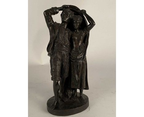 After Fernand Lorrain (19th century), a bronze figure of lovers sheltering from the rainDark brown patina, modelled as a rust