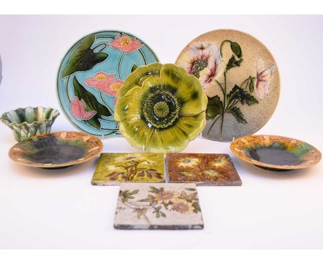 A collection of British art pottery, late 19th and early 20th century, comprising a pair of Linthorpe majolica plates, the bo