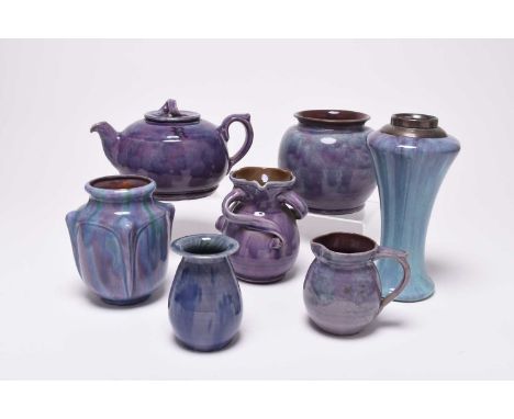 A group of British art pottery, circa 1900-1918, century, purple glazes, principally William Baron of Barnstaple, comprising 