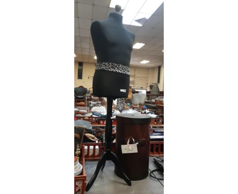 MANNEQUIN ON STAND TOGETHER WITH LEATHER LAUNDRY BASKET FROM THE HOLDING COMPANY