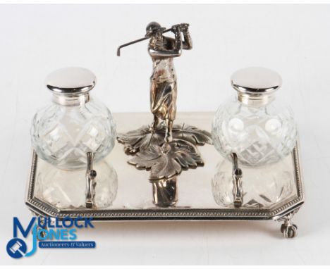 Silver Plated Female Golfer Design Inkwell Desk Stand having a central standing female golfer holding a club with two white m