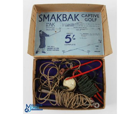 Smakbak Captive Golf Practice Aid - c/w the original Smakbak square mesh golf ball (used), both red enamel cord staples, spri