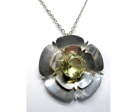 A Hallmarked Silver Pendant, FRN (Nunn), Sheffield 1974, of modernist Yorkshire Rose design, circular set to the centre, on l