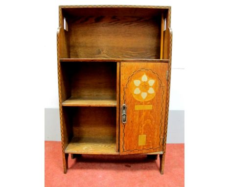 An Early XX Century Oak Bookcase, with chevron inlaid borders, single shelf over twin shelf, Arts & Crafts stylised floral de