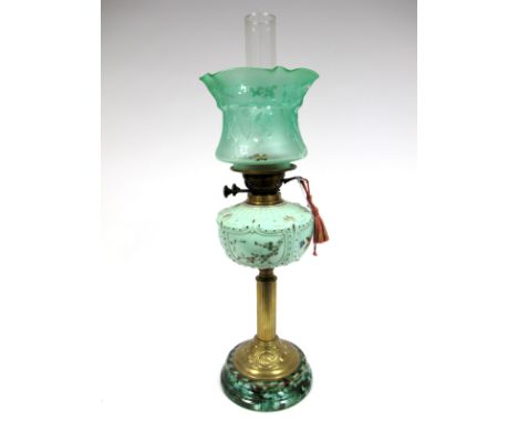 A Late XIX Century Oil Lamp, the brass Corinthian column with Art Nouveau scrolling base, opaque green glass moulded and pain