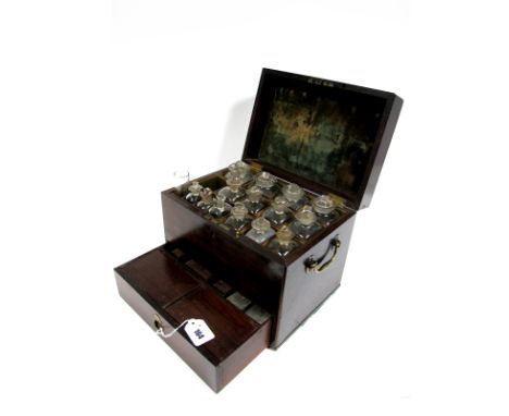An Early XIX Century Mahogany Apothecary Chest, with brass carrying handles, the lid opening to reveal fourteen glass bottles