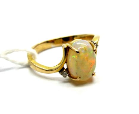 A Single Stone Opal Ring, the central oval cabochon four claw set, between crossover shoulders with claw set highlights, stam