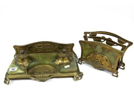An Art Nouveau Brass and Green Onyx Desk Standish and Matching Letter Rack, cast with water lilies and sinuous lines, the sta