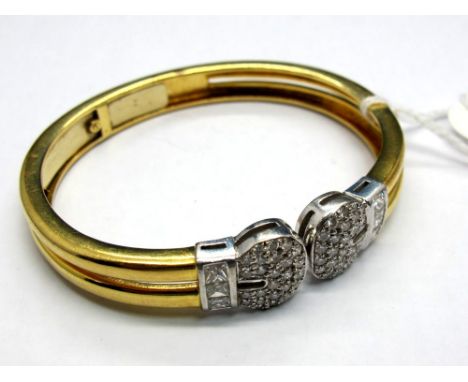 A Modern Diamond Set Bangle, of openwork plain two row design, claw set to the front with uniform brilliant cut stones and ch