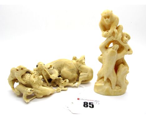 A Late XIX Century Japanese Carved Ivory Okimono, in the form of a rat and six young rats, playing beside a barrel, 11cm long