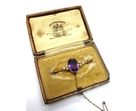An Amethyst and Diamond Set Brooch, oval collet set to the centre between six circular collet set old cut diamonds, on knife 