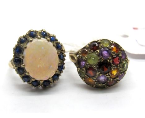 A 9ct Gold Opal Set Cluster Ring, oval cabochon claw set to the centre, between trifurcated shoulders; Together with A 9ct Go