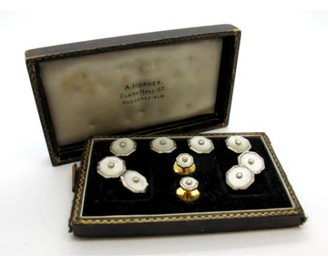 A Pair of Art Deco Gent's Cufflinks, stamped "9ct & 18ct WG", the octagonal panels highlighted in white enamel, on chain conn