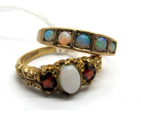 A 9ct Gold Three Stone Ring, graduated set between textured shoulders; Together with A Five Stone Opal Ring, circular cabocho