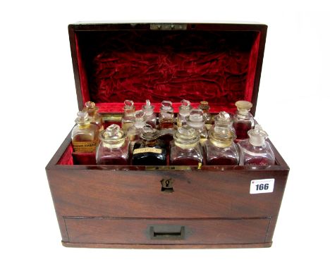 An Early XIX Century Mahogany Apothecary Chest, with recessed brass handles, the lid opening to reveal seventeen glass bottle