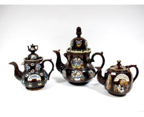 A Mid XIX Century Barge Ware Teapot and Cover, with teapot finial, applied with flowers and inscribed "A Present to a Friend"