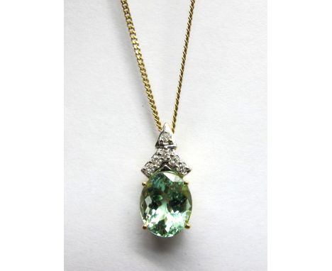 An 18ct Gold Paraiba Tourmaline Single Stone Pendant, oval four claw set, below brilliant cut diamond set surmount, on 9ct go