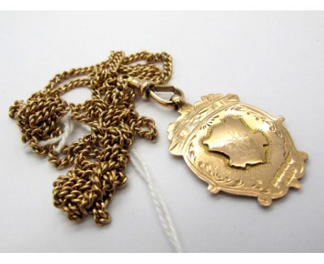 A Curb Link Guard Type Chain, to single swivel stamped "9c", suspending a 9ct gold medallion pendant.