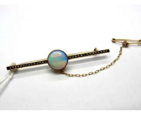 An Opal Set Bar Brooch, circular cabochon set to the centre, on seed pearl inset bar. 