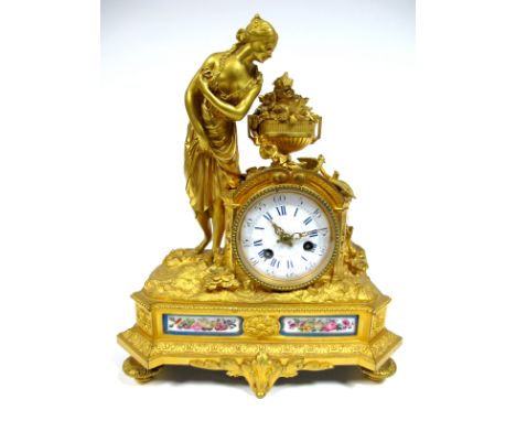 A Mid XIX Century French Ormolu Mantel Clock, the white enamel dial with Roman numerals and inscribed "Azur a Paris", surmoun