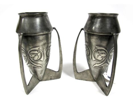 A Pair of Art Nouveau Pewter Vases, in the style of Archibald Knox for Liberty, unmarked, cast with stylised foliage on pierc