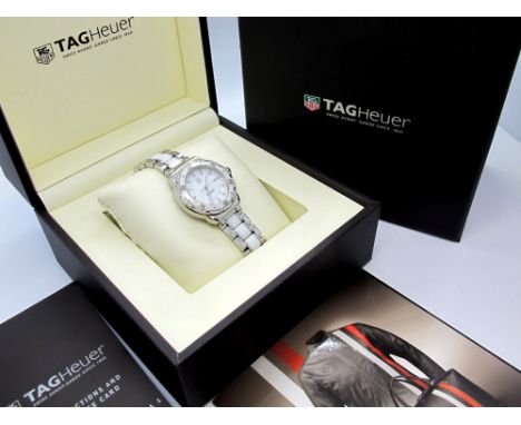 TAG Heuer; A Formula 1 Diamond Set Ladies Wristwatch, Ref:WAH1313.BA0868, the signed dial with diamond markers, within cerami