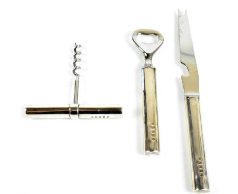 CARRS OF SHEFFIELD; an Elizabeth II hallmarked silver mounted service comprising corkscrew, bottle holder and cheese knife, e