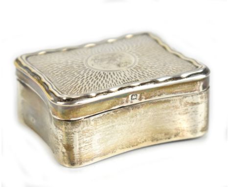 SOTHERS, ORCHARD &amp; CO; an Edwardian hallmarked silver trinket box of rounded rectangular form, the engine turned decorate